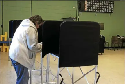  ?? NICHOLAS BUONANNO — NBUONANNO@TROYRECORD.COM ?? A Rensselaer County resident votes Tuesday afternoon, at the Lansingbur­gh Boys and Girls Club, in the 107th Assembly district special election.