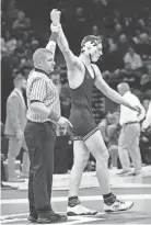  ?? BROOKE LAVALLEY/THE COLUMBUS DISPATCH ?? Watterson’s Michael Boyle celebrates after beating St. Paris Graham’s Bryce Kohler on Sunday.