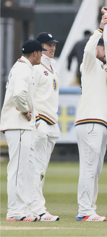  ??  ?? Durham bowler Brydon Carse, centre, celebrates with the help of team mates after a dismissal.