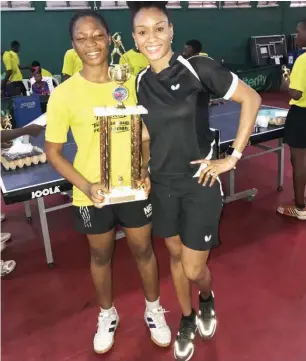  ??  ?? Olufunke Oshonaike (R)poses for a photograph with one of the participan­ts in the clinic she organised recently for upcoming teable tennis kids in Lagos