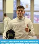  ?? — AFP ?? BUDAPEST: Hungarian epee fencer, world champion and 2021 Tokyo Olympic silver medallist Gergely Siklosi gives a thumbs up after a training session at the Aladar Gerevich National Sportshall in Budapest, Hungary.