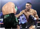  ?? Photograph: Top Rank/Getty Images ?? Teófimo López lands a punch on Vasiliy Lomachenko during Saturday’s fight.