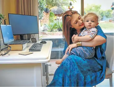  ?? Picture: Sebabatso Mosamo ?? Lauren Campbell with her 15-month-old son, Daniel. She says she is looking forward to going back to her office because productivi­ty is a challenge with a toddler to look after while she is trying to work.