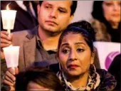  ?? JEENAH MOON /REUTERS ?? People gather for a candleligh­t vigil in Queens, New York, following a shooting at a synagogue in Pittsburgh, Pennsylvan­ia on Saturday in which 11 people were killed.