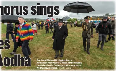  ??  ?? President Michael D. Higgins does a walkabout with Peader O Riada at the Féile na Laoch Festival in Coolea, just after sunrise on Wednesday morning. Pic John Delea.