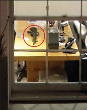  ??  ?? Alert: The M16 assault rifle, circled, in Mrs Taylor-Johnson’s basement