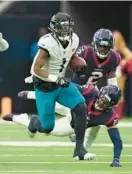  ?? ERIC CHRISTIAN SMITH/AP ?? Jaguars running back Travis Etienne Jr. runs past the Texans defense during a game Sunday in Houston.