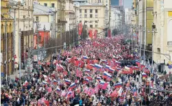  ?? DENIS TYRIN/AP ?? People attend the Immortal Regiment march marking the 77th anniversar­y of the end of World War II, in Moscow, Russia, Monday.