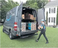  ?? TED S. WARREN/THE ASSOCIATED PRESS ?? Amazon has planned to launch a delivery service for businesses, dubbed Shipping with Amazon, that enables entreprene­urs to pick up packages from businesses and ship them to consumers.