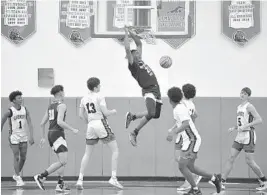  ?? MICHAEL LAUGHLIN/SUN SENTINEL ?? North Broward Prep’s Justin Abson scores two points during the first half against Sagemont on Friday.