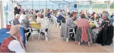  ?? ?? The charity quiz in full swing in the canalside marquee.