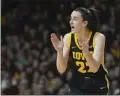  ?? ABBIE PARR — THE ASSOCIATED PRESS ?? Iowa guard Caitlin Clark claps during the second half against Minnesota on Wednesday in Minneapoli­s.