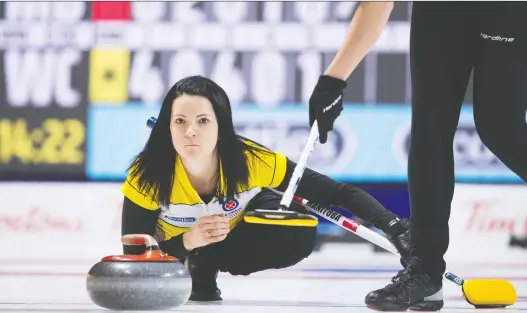  ?? JONATHAN HAYWARD/THE CANADIAN PRESS ?? Team Manitoba skip Kerri Einarson takes a shot during a 9-6 win over three-time Canadian champion Rachel Homan of Ontario on Friday.