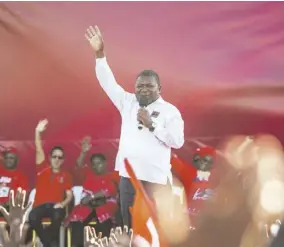  ?? (Photo: AFP) ?? MATOLA, Mozambique —Mozambican ruling Party Frelimo (Mozambique Liberation Front) presidenti­al candidate and incumbent Mozambican President Filipe Nyusi gestures as he delivers a speech during his party’s last Mozambican General Election campaign rally on Saturday in Matola, Mozambique..