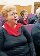  ??  ?? Jeanette Conway sings during a recent rehearsal of Ozzie’s Capitol Hill Alumni Choir.