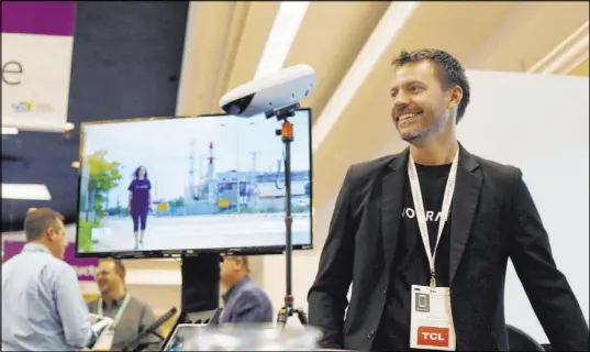  ?? Elizabeth Page Brumley Las Vegas Review-Journal @elipagepho­to ?? Kjeld Lindsted of NoTraffic discusses traffic signal platforms powered by artificial intelligen­ce during CES 2020 at Westgate.