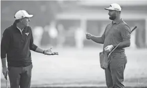  ?? AP ?? Jon Rahm, right, says that he thinks the Memorial Tournament should feature a cut, and players should have to earn their right to play over the weekend, contrary to the stance of Phil Mickelson, left.