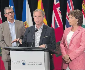 ?? ANDREW VAUGHAN / THE CANADIAN PRESS ?? A loss for Paul Davis, left, would mean no government in Canada is headed by a big-C Conservati­ve. Although not Conservati­ve, Saskatchew­an’s Brad Wall, centre, and B.C.’s Christy Clark, right, have governed with centre-right values.