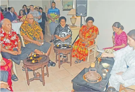  ?? ?? A Japan embassy staff member prepares green tea to acting Chief Justice, Salesi Temo, left, President Ratu Wiliame Katonivere, Prime Minister’s wife Suluweti Rabuka and First Lady Filomena Katonivere during the 64th birthday of His Majesty the Emperor of Japan Rokuichiro Michii at the ambassador’s residence at Tamavua, Suva last Friday.