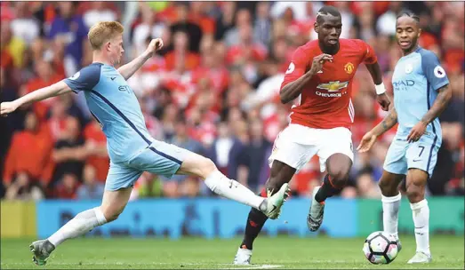  ??  ?? Kevin De Bruyne of Manchester City challenges Paul Pogba of Manchester United during the Premier League match between Manchester United and Manchester City at Old Trafford on September 10, 2016