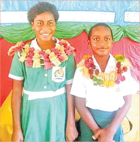  ?? Picture: SUPPLIED ?? The Natusara Primary School head girl Makitalena Asenaca Dautei, left, and head boy Inoke Delai during the prefect investitur­e at the school last week.