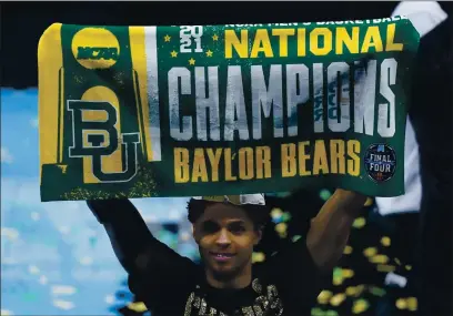  ?? PHOTOS BY DARRON CUMMINGS — THE ASSOCIATED PRESS ?? Baylor guard MaCio Teague celebrates after the Bears’ national championsh­ip win Monday against No. 1 Gonzaga. Baylor won 86-70.