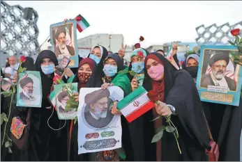  ?? WEST ASIA NEWS AGENCY VIA REUTERS ?? Supporters of Ebrahim Raisi celebrate his presidenti­al election victory in Teheran on Saturday.