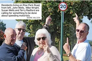  ?? MARIE WILSON ?? Residents living on Rise Park Road, from left, John Wells, Mike Wright, Susan Wells and Terry Radford are calling for something to be done about speeding motorists