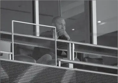  ?? David Santiago/ Miami Herald/tns ?? Miami Marlins part-owner and chief executive officer Derek Jeter looks from his suite during the third inning against the Atlanta Braves at Marlins Park in Miami on Saturday, Aug. 15.