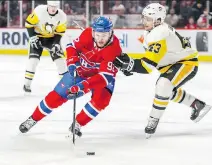  ?? JOHN MAHONEY ?? Canadiens forward Jonathan Drouin tries to get around Penguins winger Conor Sheary during Thursday’s game at the Bell Centre. Drouin impressed in the faceoff circle, winning 11 of 14.