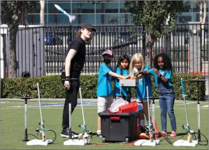  ?? PHOTOS BY CHUCK BENNETT ?? The U.S. Space Force field command responsibl­e for national security space systems and on-orbit defense capabiliti­es celebrates its oneyear anniversar­y with a rocket build and launch STEM event for El Segundo-area students Friday.
