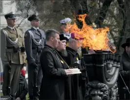  ?? CZAREK SOKOLOWSKI — THE ASSOCIATED PRESS ?? A rabbi prays at a Warsaw Ghetto Uprising commemorat­ion reception in Poland, on Wednesday. Jews who took up arms against Nazi forces in 1943 were remembered.