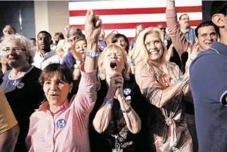  ?? Joe Raedle / Getty Images ?? Hillary Clinton supporters rejoice over primary returns Tuesday in West Palm Beach, Fla. Both Clinton and GOP front-runner Donald Trump now seek to shift the focus to November, partly since their campaigns benefit from a sense of inevitabil­ity,...