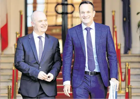  ?? PHOTO: GERRY MOONEY ?? Back on the same page: Tánaiste Leo Varadkar and chief medical officer Tony Holohan (left).