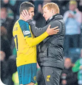  ??  ?? Mohamed Elyounouss­i is greeted by Neil Lennon after his double yesterday