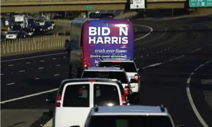  ??  ?? A bus carrying Joe Biden and Kamala Harris heads to a campaign stop in Phoenix, Arizona in October. Photograph: Carolyn Kaster/AP