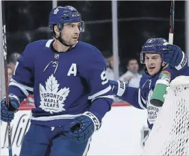  ?? ADAM HUNGER THE ASSOCIATED PRESS ?? Toronto Maple Leafs’ John Tavares, left, scored two goals on Thursday, including the 300th of his career, giving the Leafs their winning margin in a 4-2 victory at New Jersey.