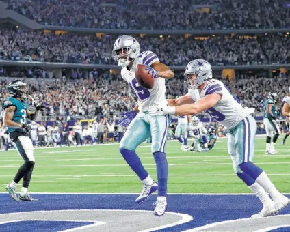  ?? Roger Steinman / Associated Press ?? Cowboys wide receiver Amari Cooper has had no problem adjusting to life in Dallas, leading the NFL in receiving yards with 642 since joining the team. He hauled in 10 passes for 217 yards in the win over the Eagles.