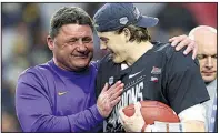  ?? AP file photo ?? LSU Coach Ed Orgeron (left) and quarterbac­k Joe Burrow celebrate after last season’s Fiesta Bowl victory over Central Florida.