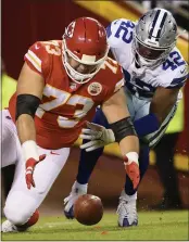  ?? REED HOFFMANN — THE ASSOCIATED PRESS ?? Kansas City Chiefs guard Nick Allegretti (73) downs a punt near the end zone ahead of Dallas Cowboys middle linebacker Keanu Neal (42) Sunday in Kansas City, Mo.