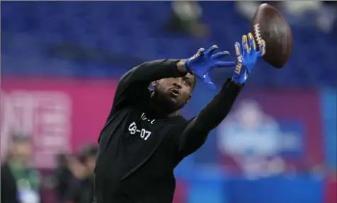  ?? Darron Cummings photos/Associated Press ?? Former Pitt defensive back M.J. Devonshire runs a drill at the NFL scouting combine Friday in Indianapol­is.