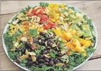  ?? AP PHOTO ?? Pairing black beans with fresh mango results in a spectacula­r salad and are delicious.