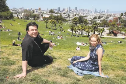  ?? Liz Hafalia / The Chronicle ?? Zyzzyva editors Oscar Villalon and Laura Cogan, seen at Dolores Park in San Francisco, have led the creation of the literary journal’s online and live events programmin­g, including writing workshops taught by acclaimed authors.