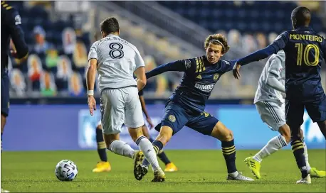  ?? SUBMITTED PHOTO - PHILADELPH­IA UNION ?? Union’s Brenden Aaronson, right, appears to be out of position as New England’s Matt Polster moves on the ball Tuesday night. The heavy underdog Revs upset the Union 2-0 in an MLS quarterfin­al game.