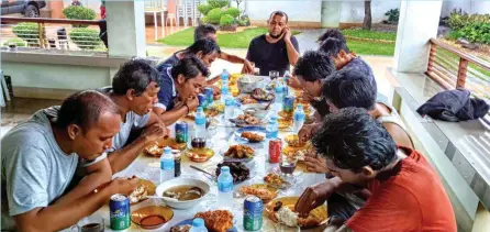  ?? (Mindanao Examiner) ?? Sulu Gov. Totoh Tan speaks on the phone while feeding the 10 Indonesian sailors who were freed by the Abu Sayyaf in Jolo town in the southern Philippine­s on May 1, 2016 after more than a month in captivity.