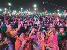  ?? Reuters ?? Female supporters of Pakistan Democratic Movement, an alliance of political opposition parties, react to party songs during an anti- government protest rally in Karachi.