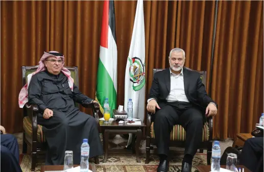  ?? (Reuters) ?? HAMAS CHIEF Ismail Haniyeh meets with Qatari envoy Mohammed Al-Emadi in Gaza City on January 24.