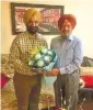  ??  ?? Sh. Amarjit Singh Samra,
„
Chairman Markfed while congratula­ting Sh. Sukhjinder Singh Randhawa, Minister for Co-operation and Jail.