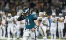  ?? BUTCH DILL — THE ASSOCIATED PRESS ?? Eagles quarterbac­k Carson Wentz (11) walks off the field after turning the ball over on downs in the second half.