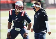  ?? Billie Weiss / Getty Images ?? Patriots offensive coordinato­r Josh McDaniels, right, talks to quarterbac­k Cam Newton before Sunday’s game against the Broncos.